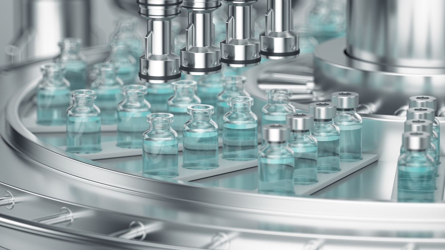 Pharmaceutical manufacture background with glass bottles with clear liquid on automatic conveyor line.
