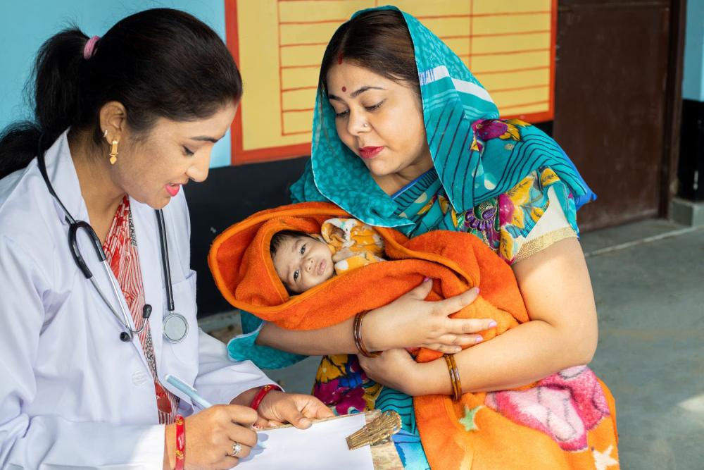 Pediatrician doctor examining new born baby